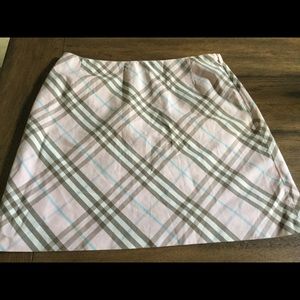 Burberry pink plaid skirt.